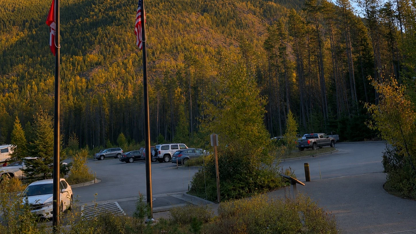 Apgar Visitor Center parking area at Lake McDonald — the largest lot in the corridor and the main shuttle hub for Glacier National Park