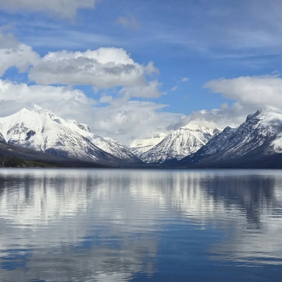 Clear shallow water and colorful argillite pebbles at Apgar Beach on Lake McDonald