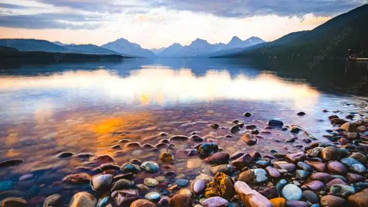 Lake McDonald sunset reflection with colorful pebbles