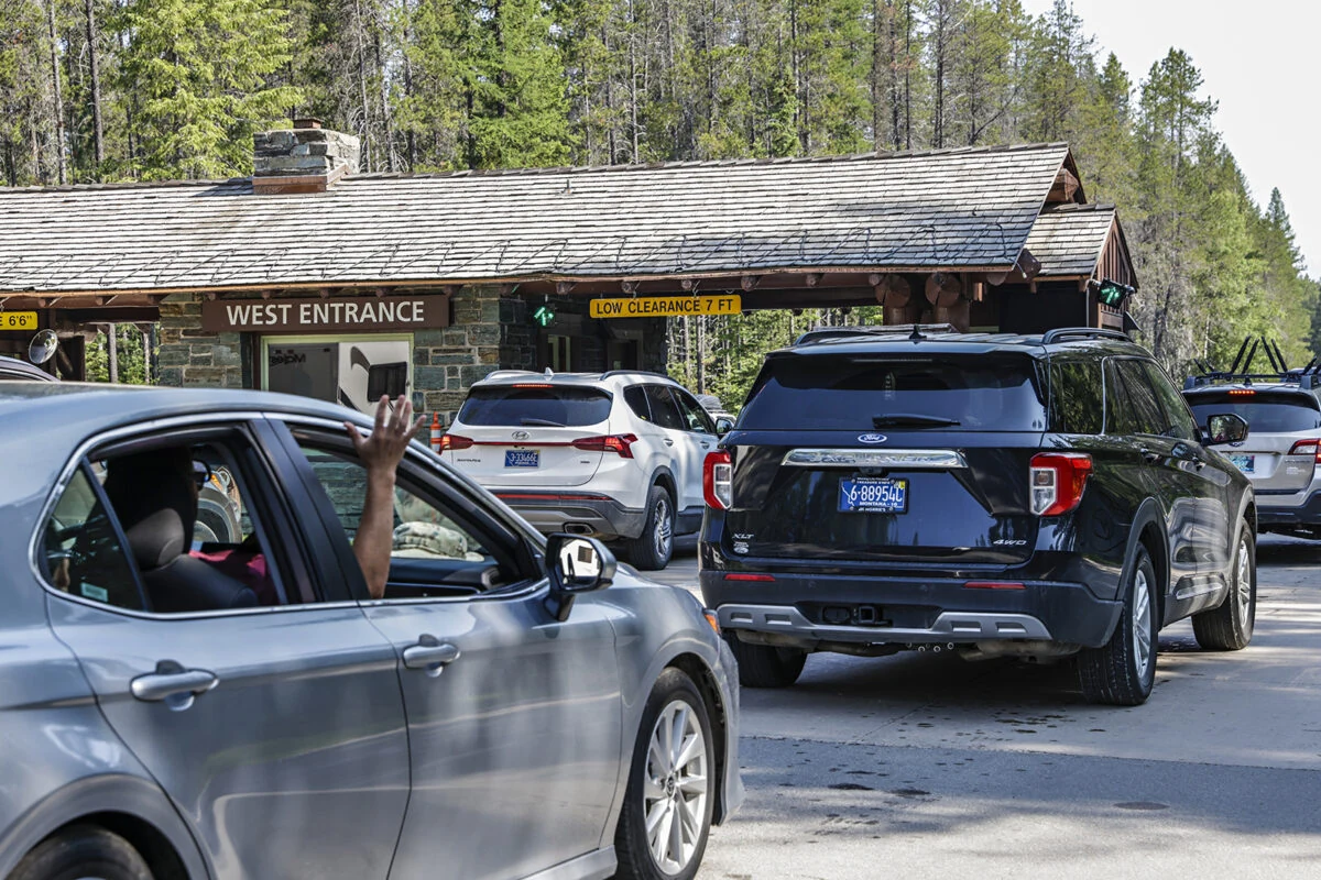 West Entrance Road into Glacier National Park — the main access route to the Lake McDonald parking corridor