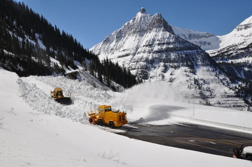 Snow plowing operations keeping Going-to-the-Sun Road clear in winter near Lake McDonald